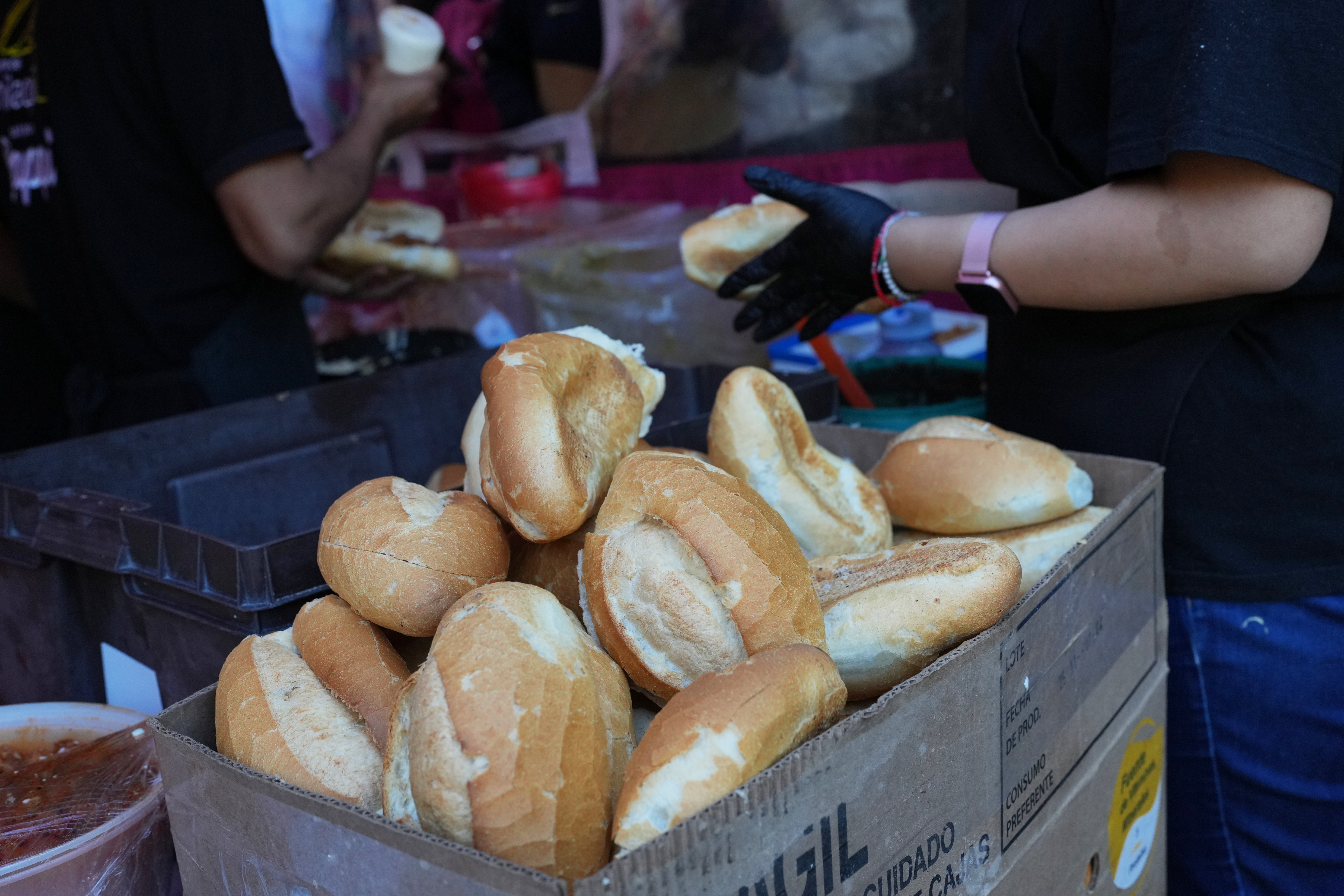 Bolillos, a traditional Mexican bread, sit for sale at a street stand in Mexico City, Dec. 18, 2025.