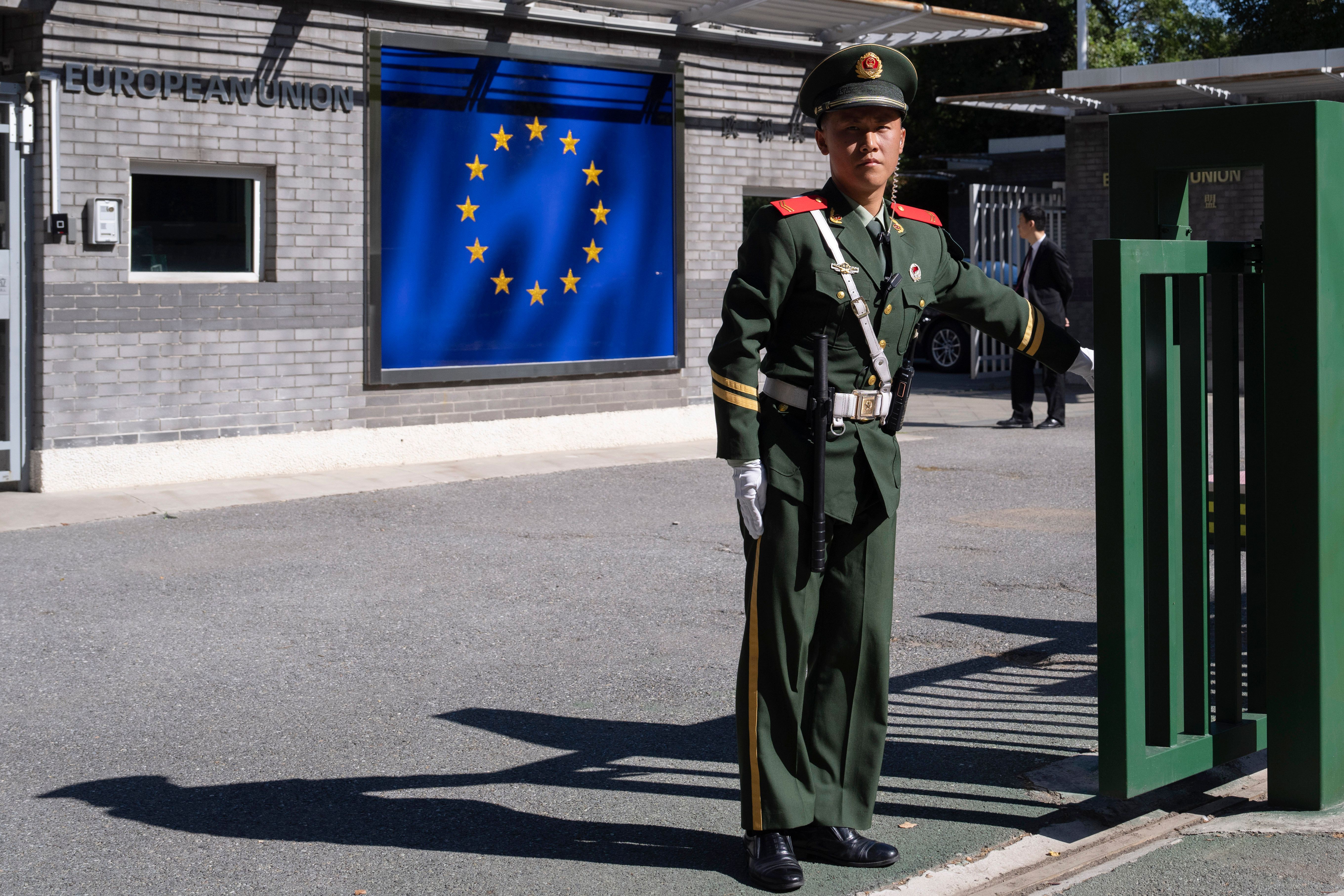 A Chinese paramilitary policeman stands guard at the entrance to the European Union Delegation to China compound in Beijing, Oct. 14, 2023.