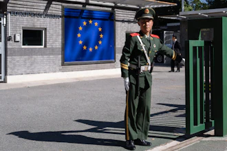 A Chinese paramilitary policeman stands guard at the entrance to the European Union Delegation to China compound in Beijing, Oct. 14, 2023.