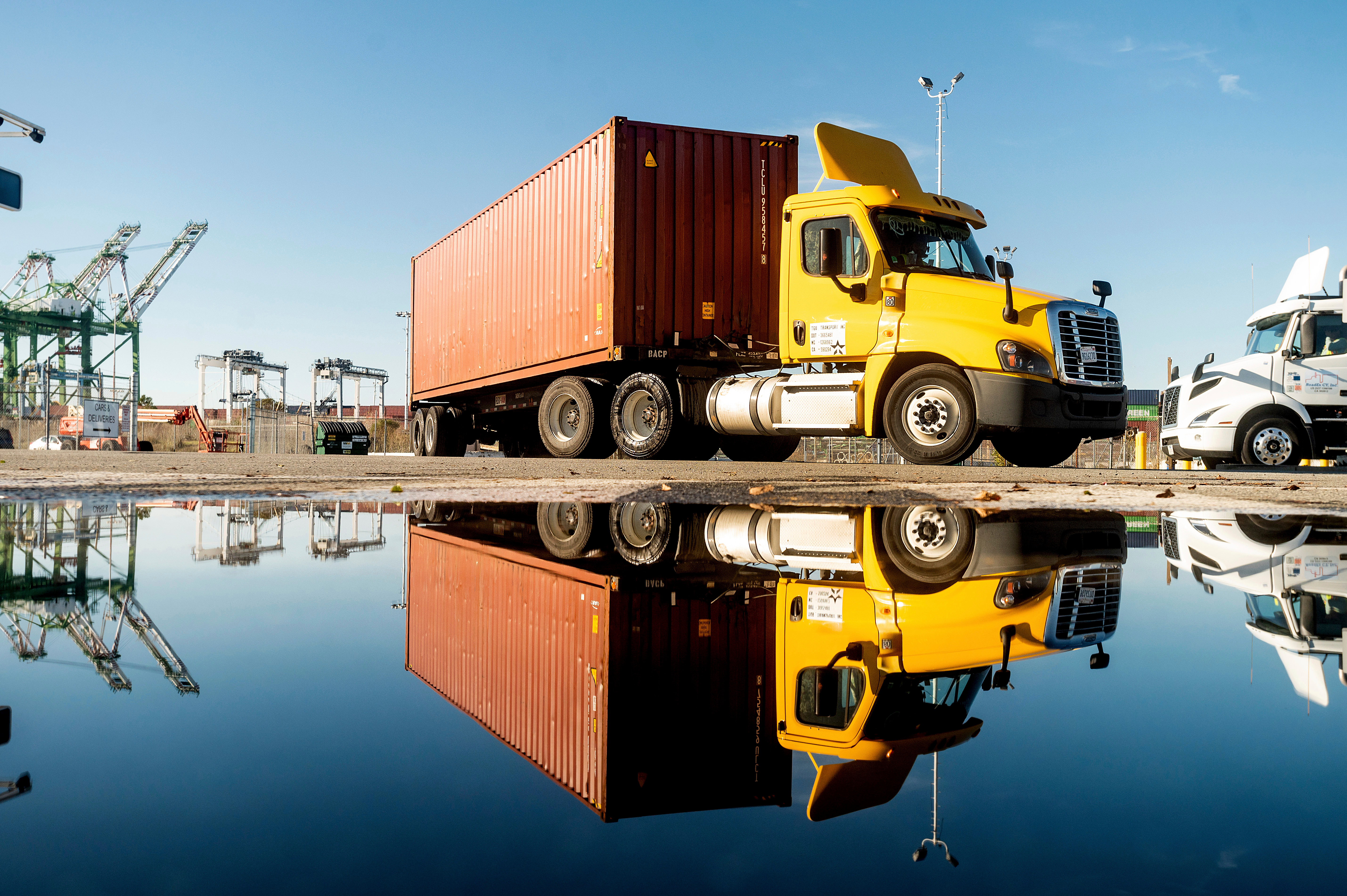 truck departs from a Port of Oakland shipping terminal on Nov. 10, 2021, in Oakland, Calif.