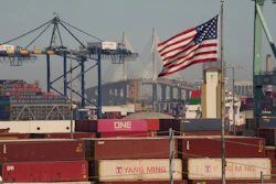 Containers with Yang Ming Marine Transport Corporation, a Taiwanese container shipping company, are stacked up at the Port of Los Angeles with the the Long Beach International Gateway Bridge seen in the background on Wednesday, April 9, 2025 in Los Angeles.