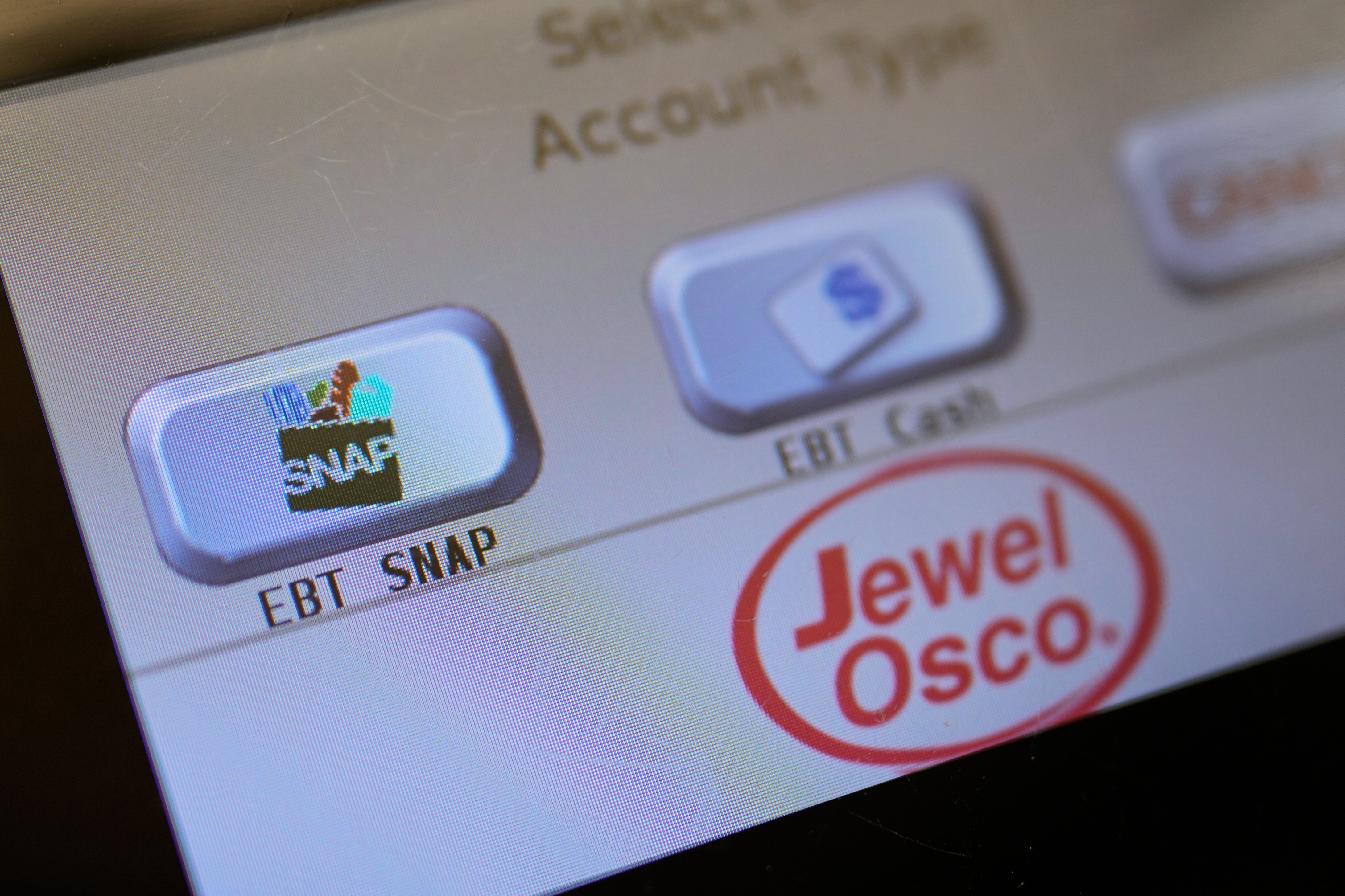 An EBT SNAP sign is shown on a self check out screen at a grocery store in Mount Prospect, Ill., Nov. 1, 2025.