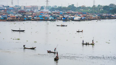 Fishermen in the lagoon in Lagos, Nigeria, Dec. 6, 2025.