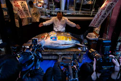 Kiyoshi Kimura, president of Kiyomura Co., poses with the bluefin tuna that won the highest bid at the annual New Year auction in Tokyo, Jan. 5, 2026.