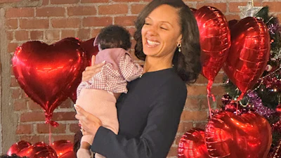 Detroit Mayor Mary Sheffield holds a child during a press conference, Detroit, Jan. 5, 2025.
