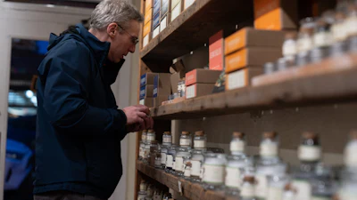 A man looks at salts for sale at The Meadow, Portland, Ore., Jan. 6, 2026.