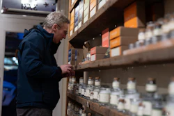 A man looks at salts for sale at The Meadow, Portland, Ore., Jan. 6, 2026.