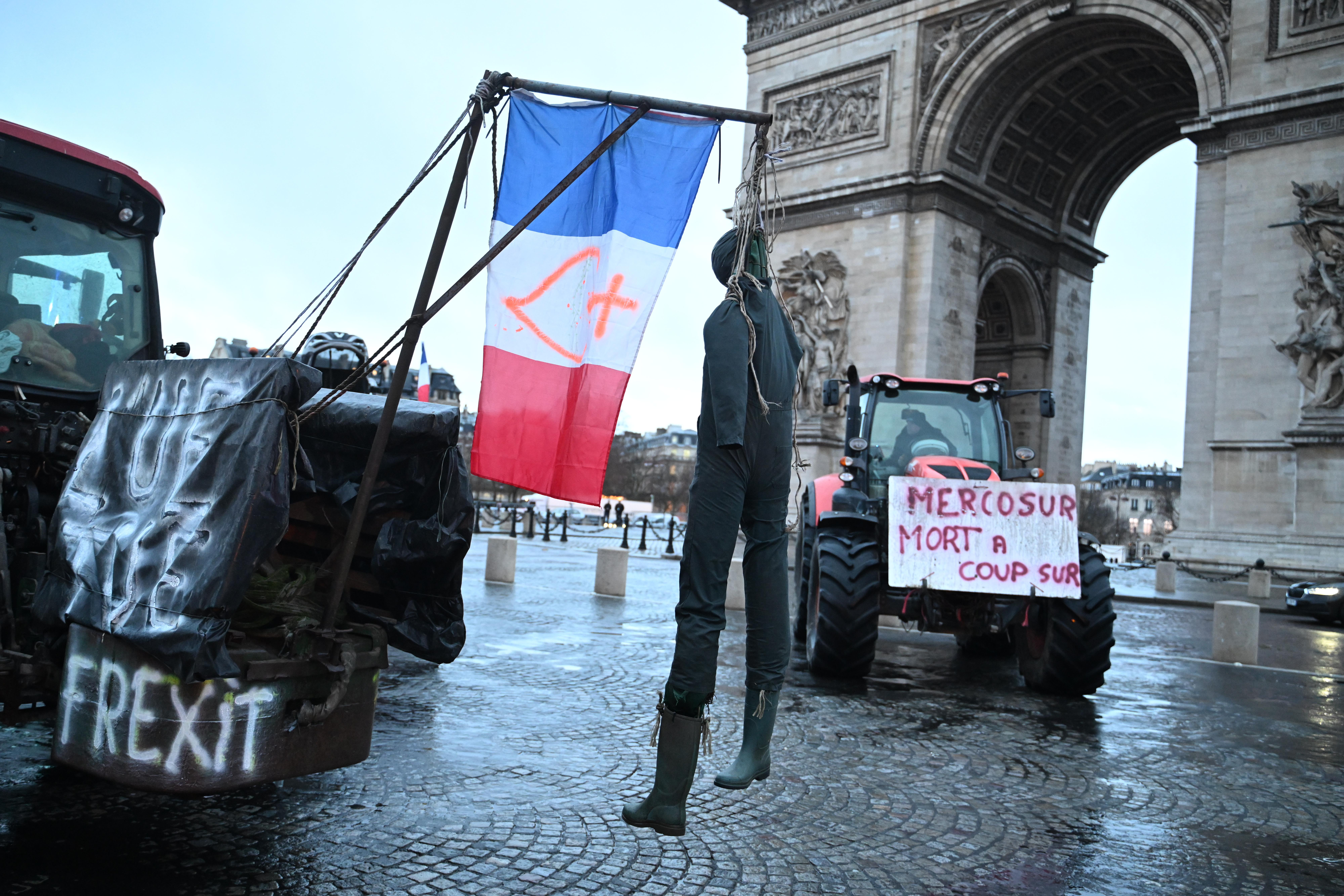 A mannequin hangs from a tractor as farmers protest at the Arc de Triomphe, Paris, Jan. 8, 2026.