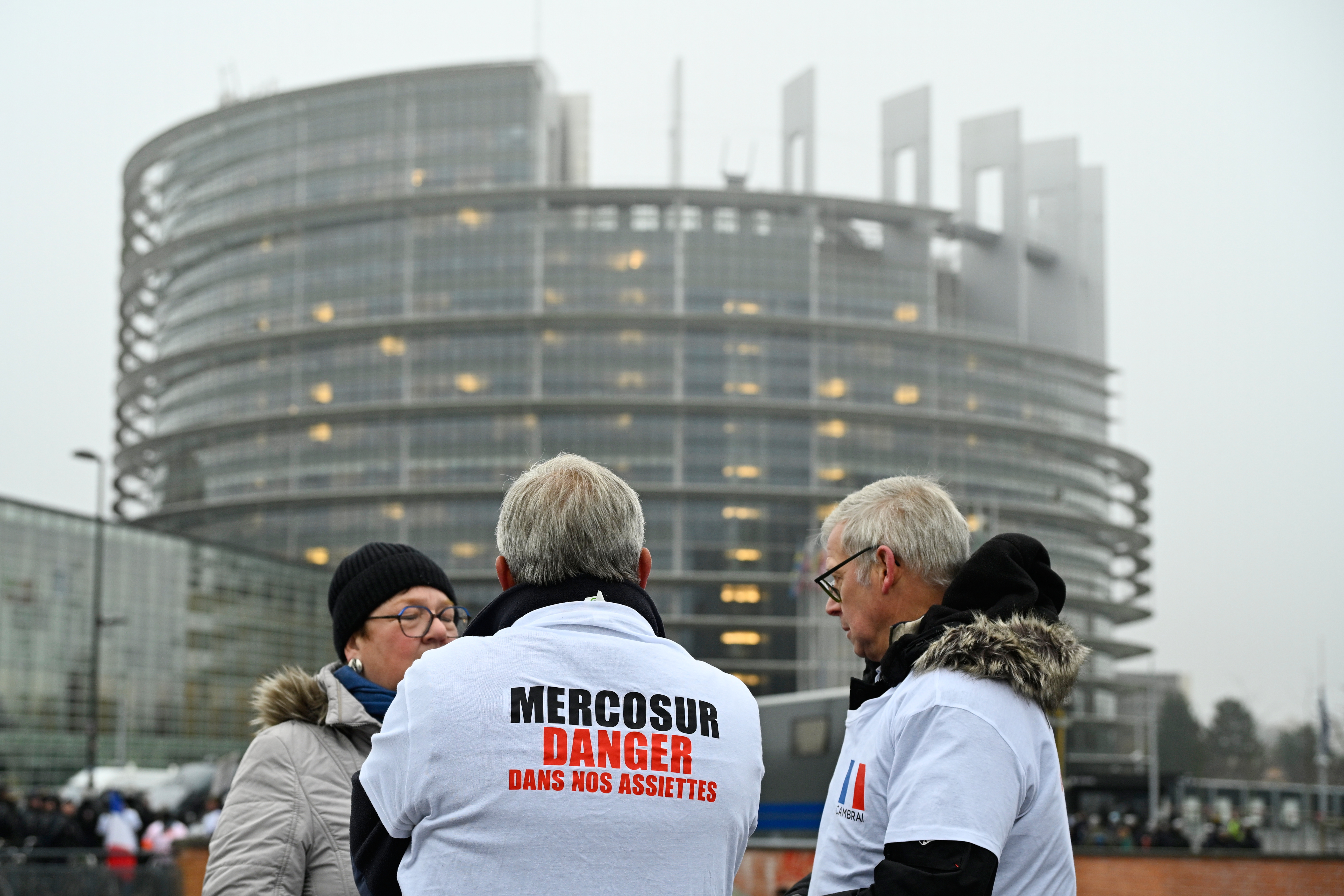 A protestor wears a shirt which reads 'Mercosur-danger on our dinner plate' outside the European Parliament in Strasbourg, France, Jan. 20, 2026.