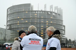 A protestor wears a shirt which reads 'Mercosur-danger on our dinner plate' outside the European Parliament in Strasbourg, France, Jan. 20, 2026.