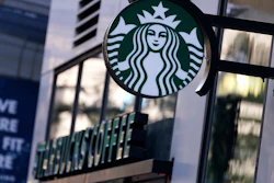 The 'Siren' logo hangs outside a Starbucks Coffee shop, July 14, 2021, Boston.