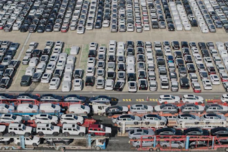 Aerial view of new cars waiting for shipment at a port in Shanghai, Jan. 14, 2026.