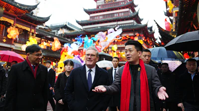 British Prime Minister Keir Starmer, center, is shown around Shanghai's Yuyuan Garden by Vice President of Yuyuan Garden Junjie Hu, Jan. 30, 2026.