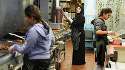 Emine Emanet, center, prepares food in the kitchen at the Jersey Kebab restaurant, Jan. 29, 2026, Collingswood, N.J.