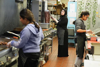 Emine Emanet, center, prepares food in the kitchen at the Jersey Kebab restaurant, Jan. 29, 2026, Collingswood, N.J.
