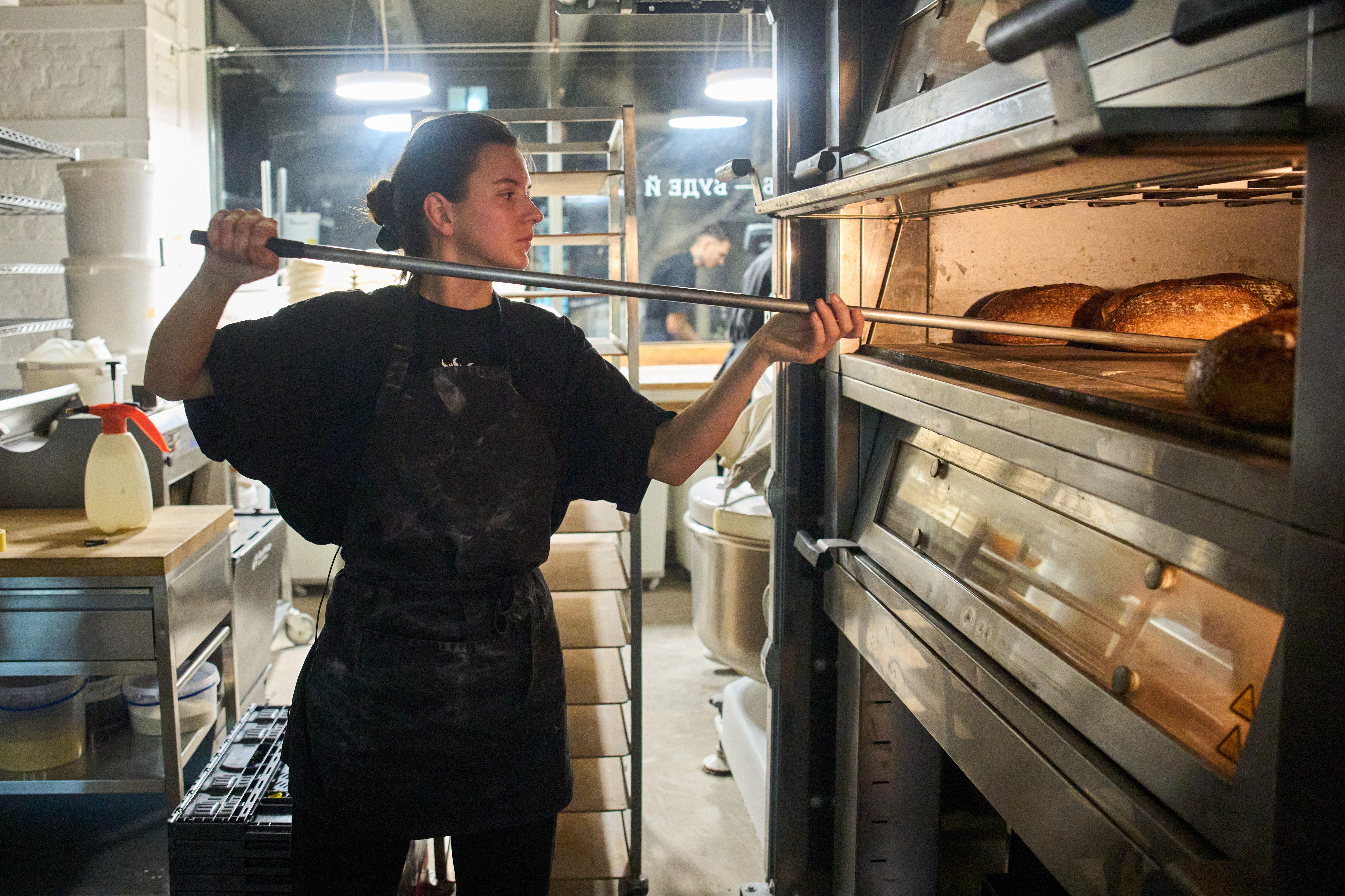 Olha Hrynchuk, 28, owner of a bakery in Kyiv, bakes bread early morning running on a generator during a blackout caused by Russia's regular air attacks on the country's energy system, Jan. 30, 2026.