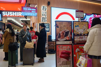 Customers wait outside a Sushiro in Beijing, Jan. 14, 2026.