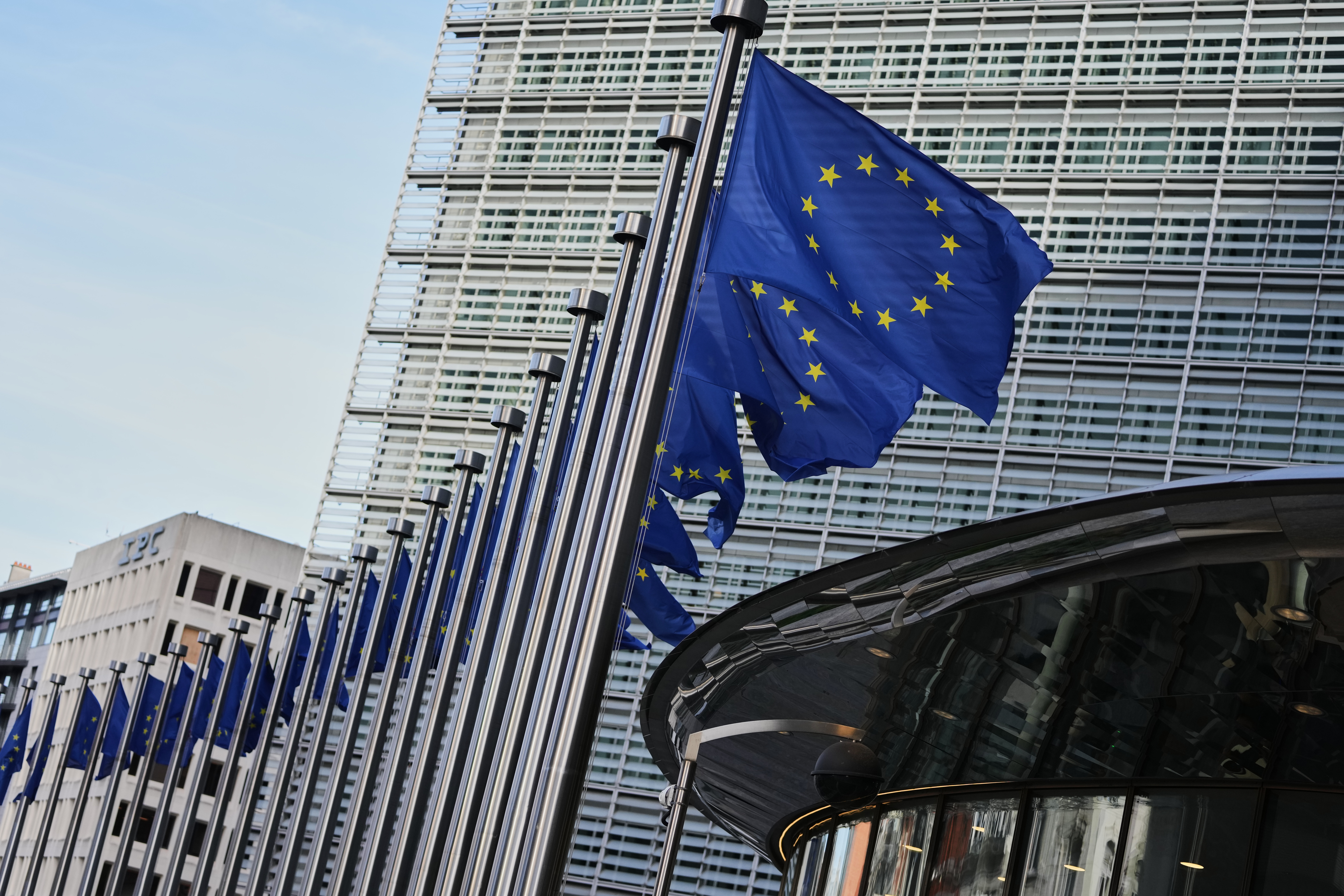 European Union flags outside of EU headquarters in Brussels, Nov. 4, 2025.