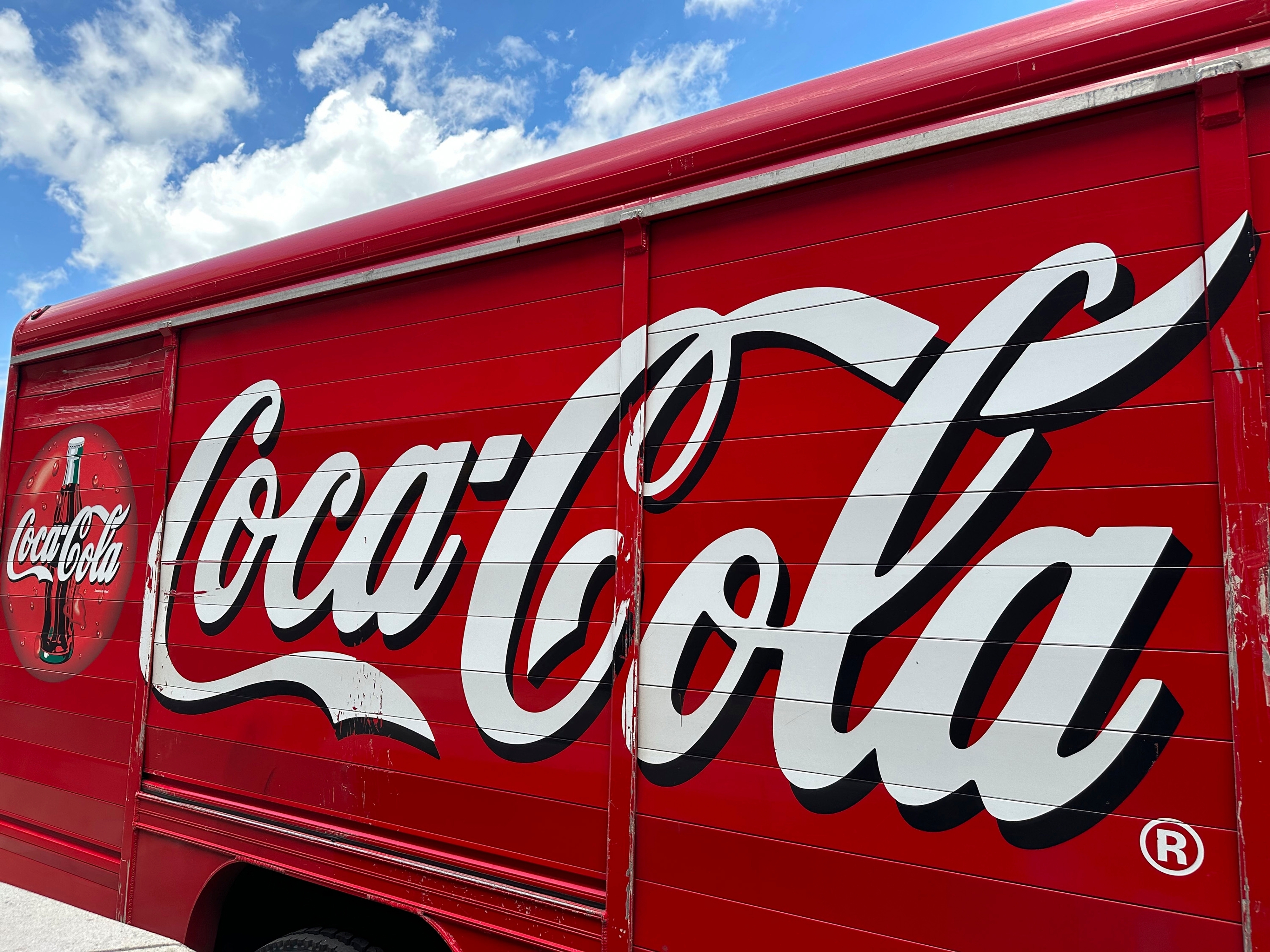 The Coca-Cola logo on the side of a delivery truck, May 15, 2024, Denver.