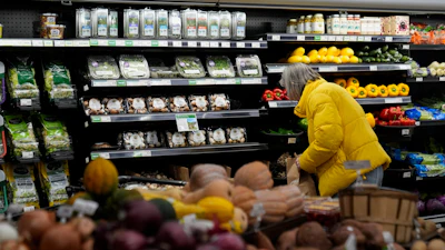 A shopper looks at produce at a grocery store in Chicago, Feb. 10, 2026.