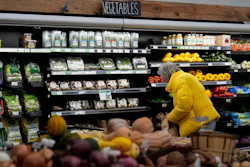 A shopper looks at produce at a grocery store in Chicago, Feb. 10, 2026.