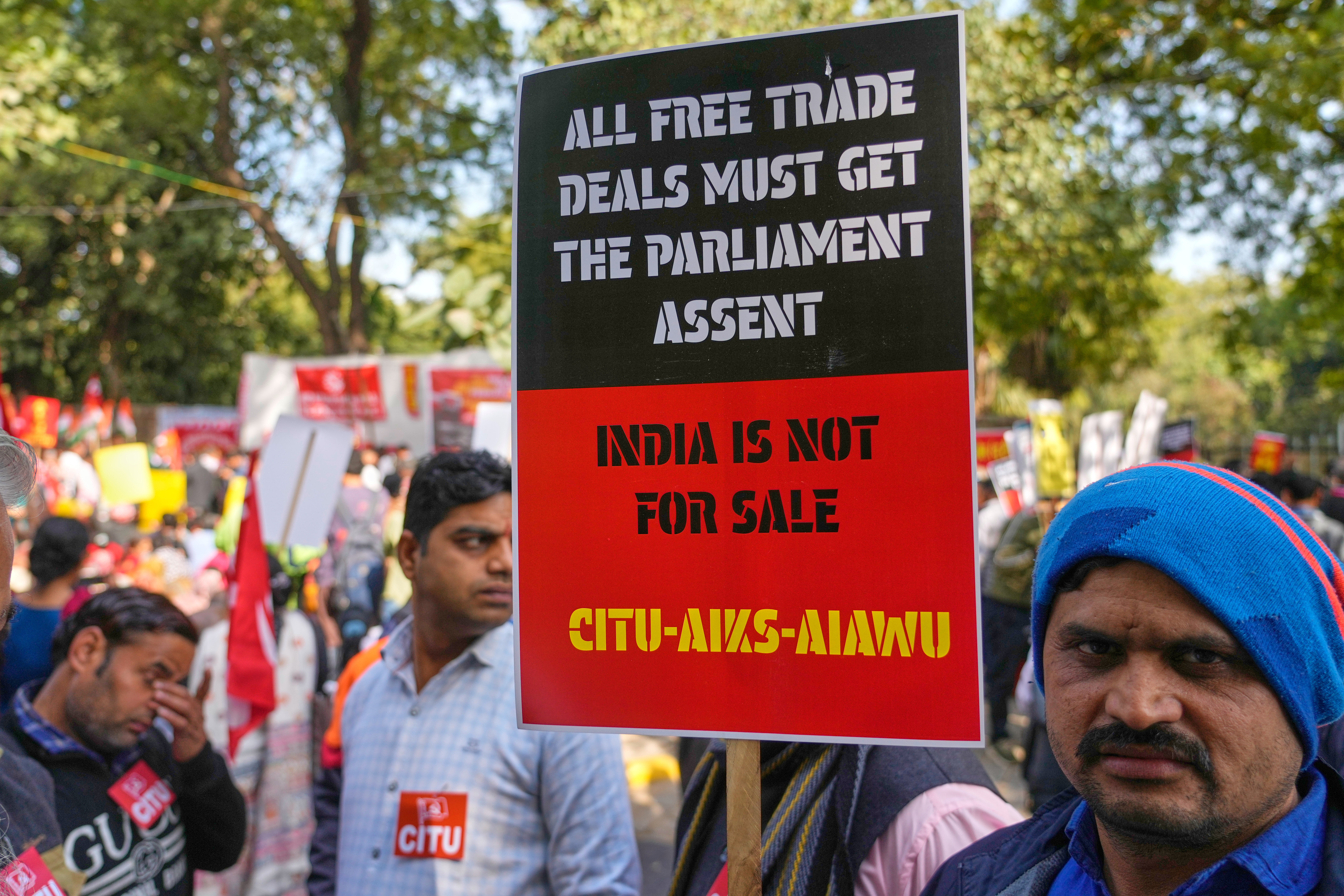 Members of trade unions hold banners during a nationwide strike, New Delhi, India, Feb. 12, 2026.