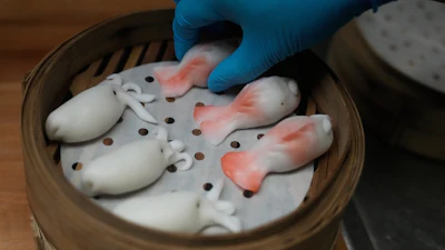 A kitchen worker prepares dumplings at the Empress by Boon restaurant in San Francisco, Jan. 8, 2026.