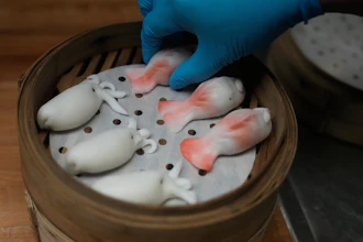 A kitchen worker prepares dumplings at the Empress by Boon restaurant in San Francisco, Jan. 8, 2026.