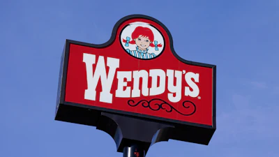 A sign stands over a Wendy's restaurant, Feb. 25, 2021, Des Moines, Iowa.