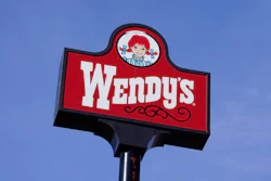 A sign stands over a Wendy's restaurant, Feb. 25, 2021, Des Moines, Iowa.