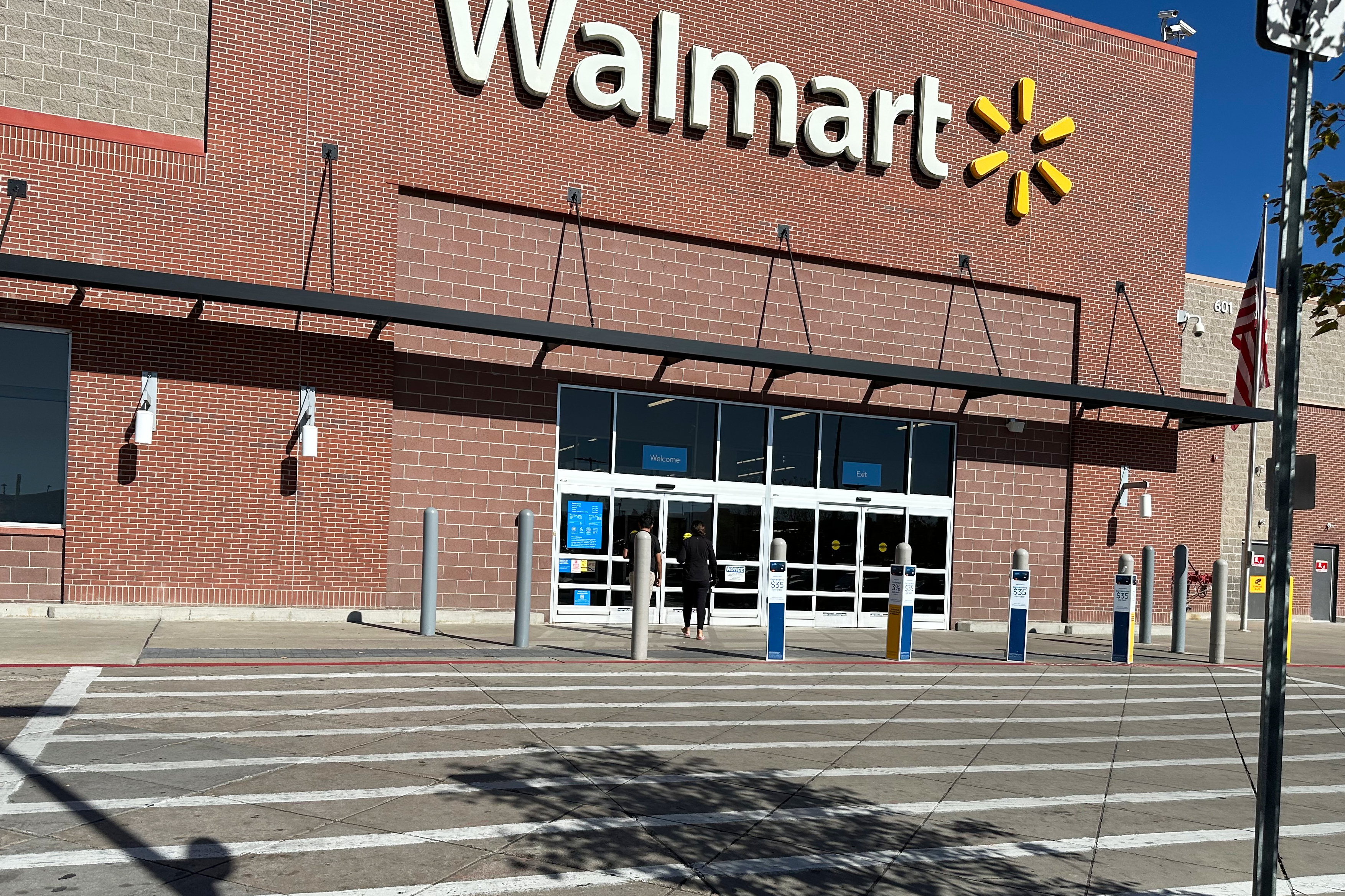 A shopper heads into a Walmart store, Oct. 16, 2025, in Englewood, Colo.