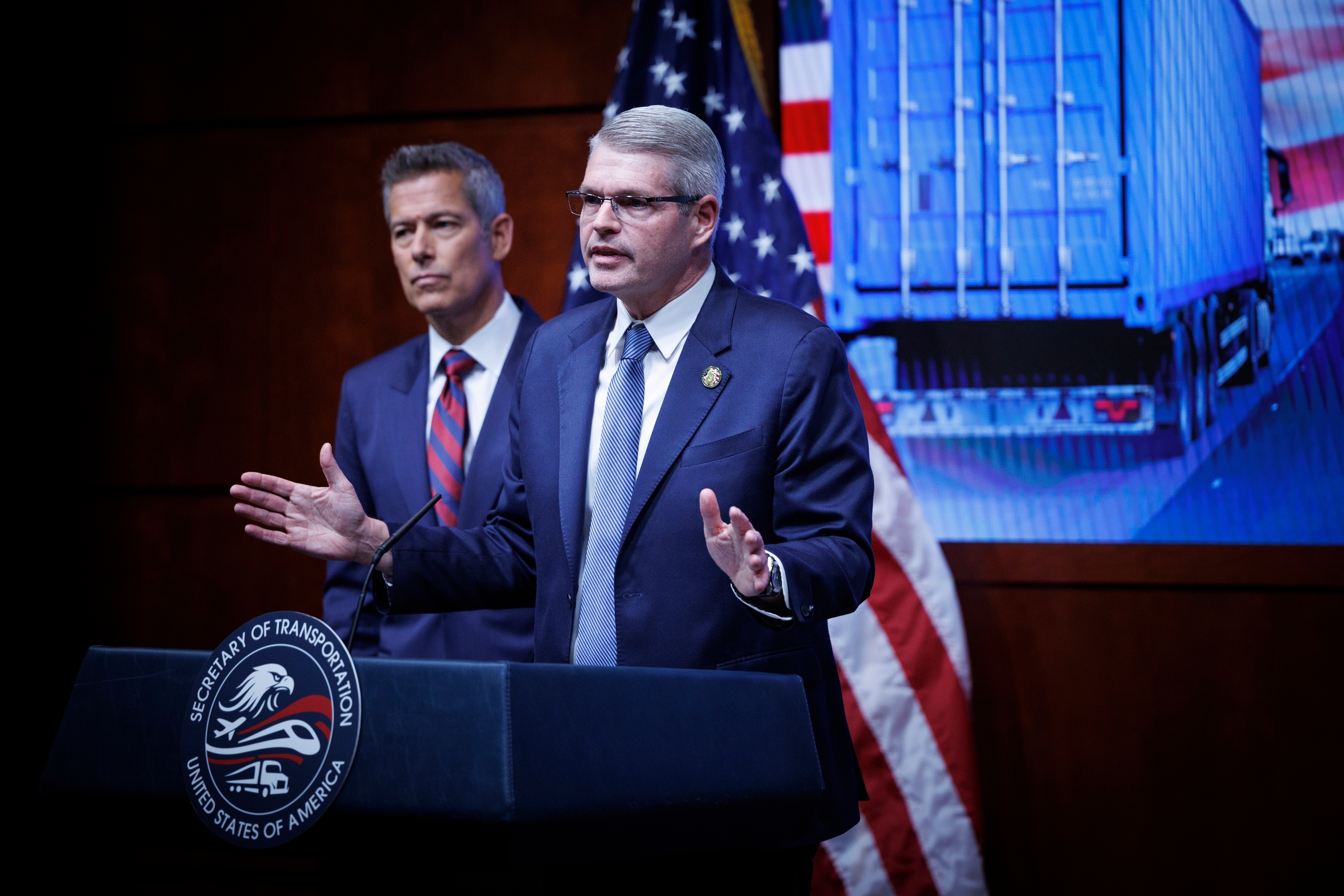 Federal Motor Carrier Safety Administrator Derek Barrs speaks beside Transportation Secretary Sean Duffy, left, during a news conference at the U.S. Department of Transportation, Feb. 20, 2026, Washington.