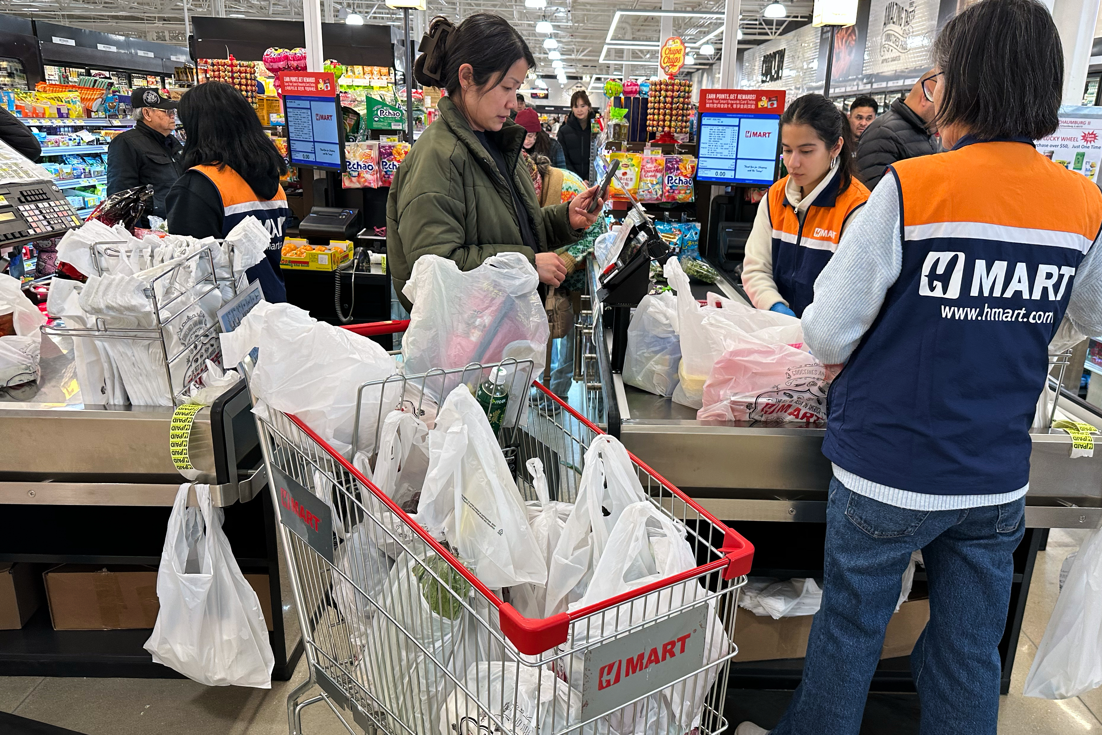 A shopper checks out at a grocery store in Schaumburg, Ill., Feb. 9, 2026.