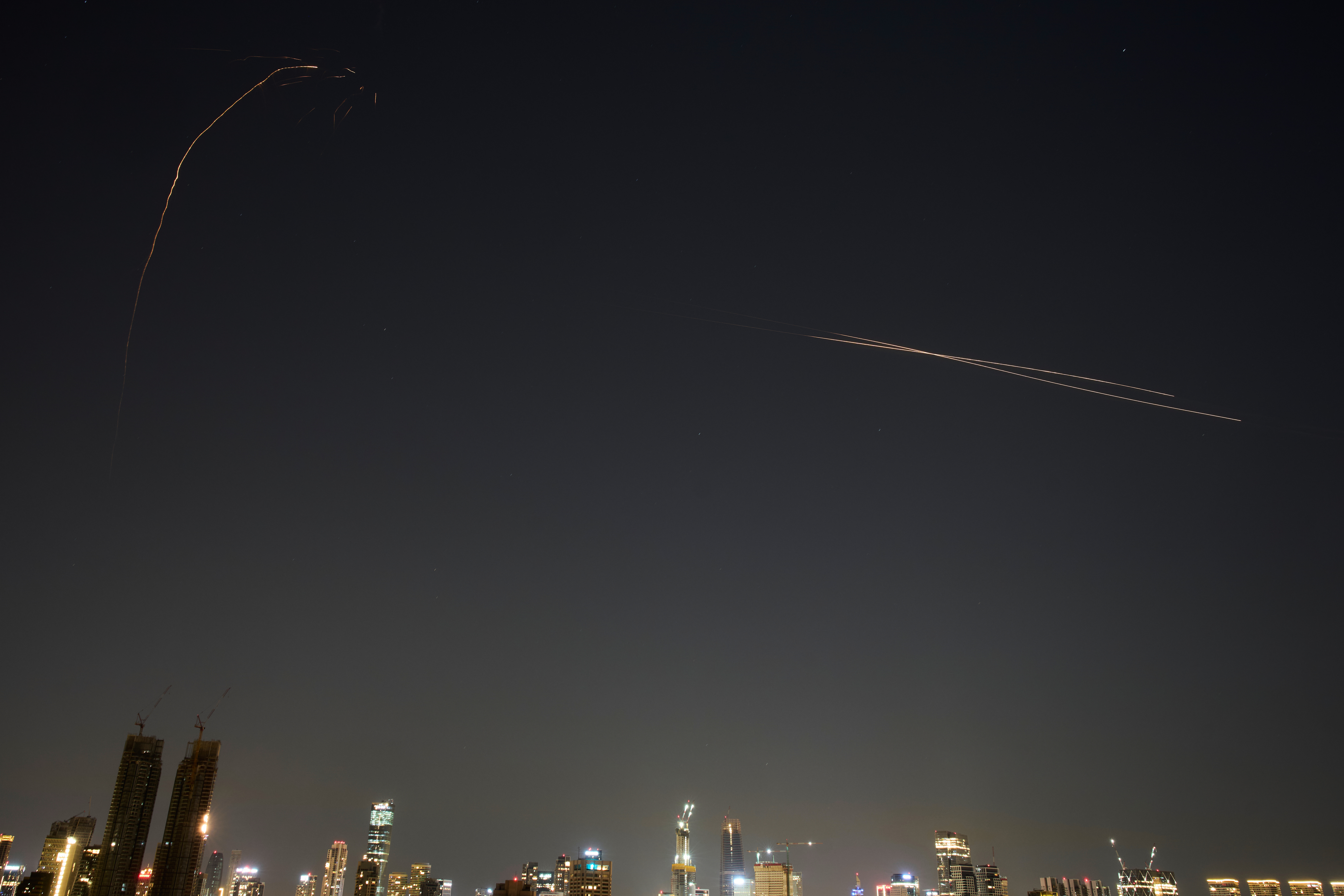 The Israeli air defense system fires to intercept missiles during an Iranian attack over Tel Aviv, March 3, 2026.