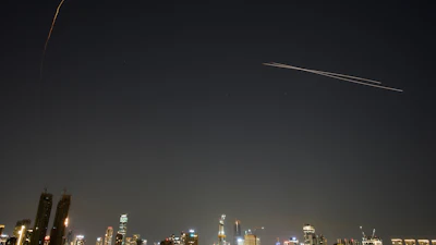 The Israeli air defense system fires to intercept missiles during an Iranian attack over Tel Aviv, March 3, 2026.