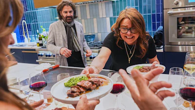 Rachael Ray serves the main course to guests at a private dinner during the South Beach Wine and Food Festival, Feb. 20, 2026, Miami.
