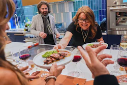 Rachael Ray serves the main course to guests at a private dinner during the South Beach Wine and Food Festival, Feb. 20, 2026, Miami.