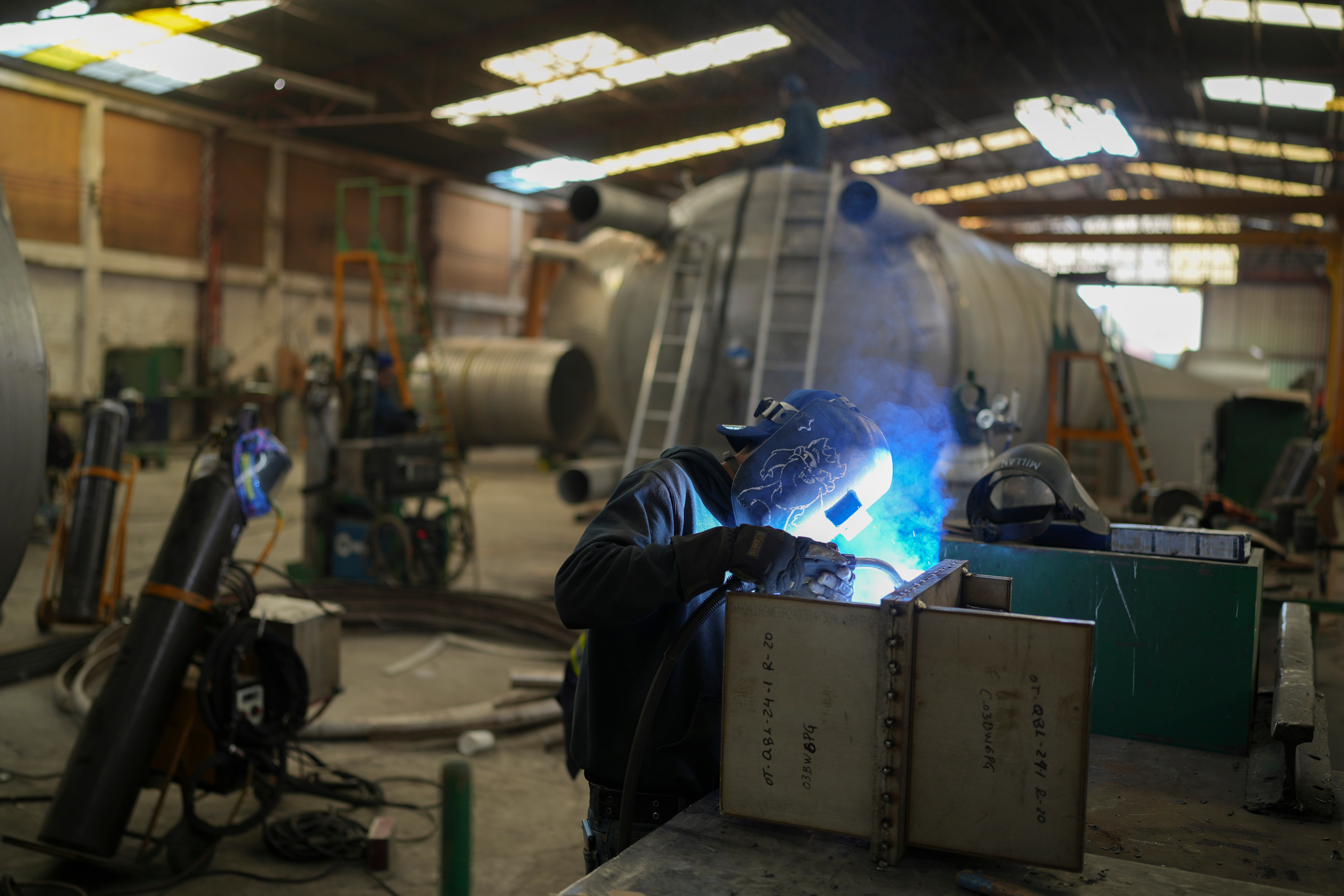 An employee welds metal at a steel tank factory in Mexico City, Feb. 11, 2025.
