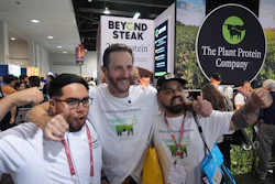 Beyond CEO Ethan Brown, center, with Beyond Meat kitchen assistant Hector Torres, left, and Antonio Partida Sr., kitchen prep, at the Natural Products Expo West, Anaheim, Calif., March 5, 2026.