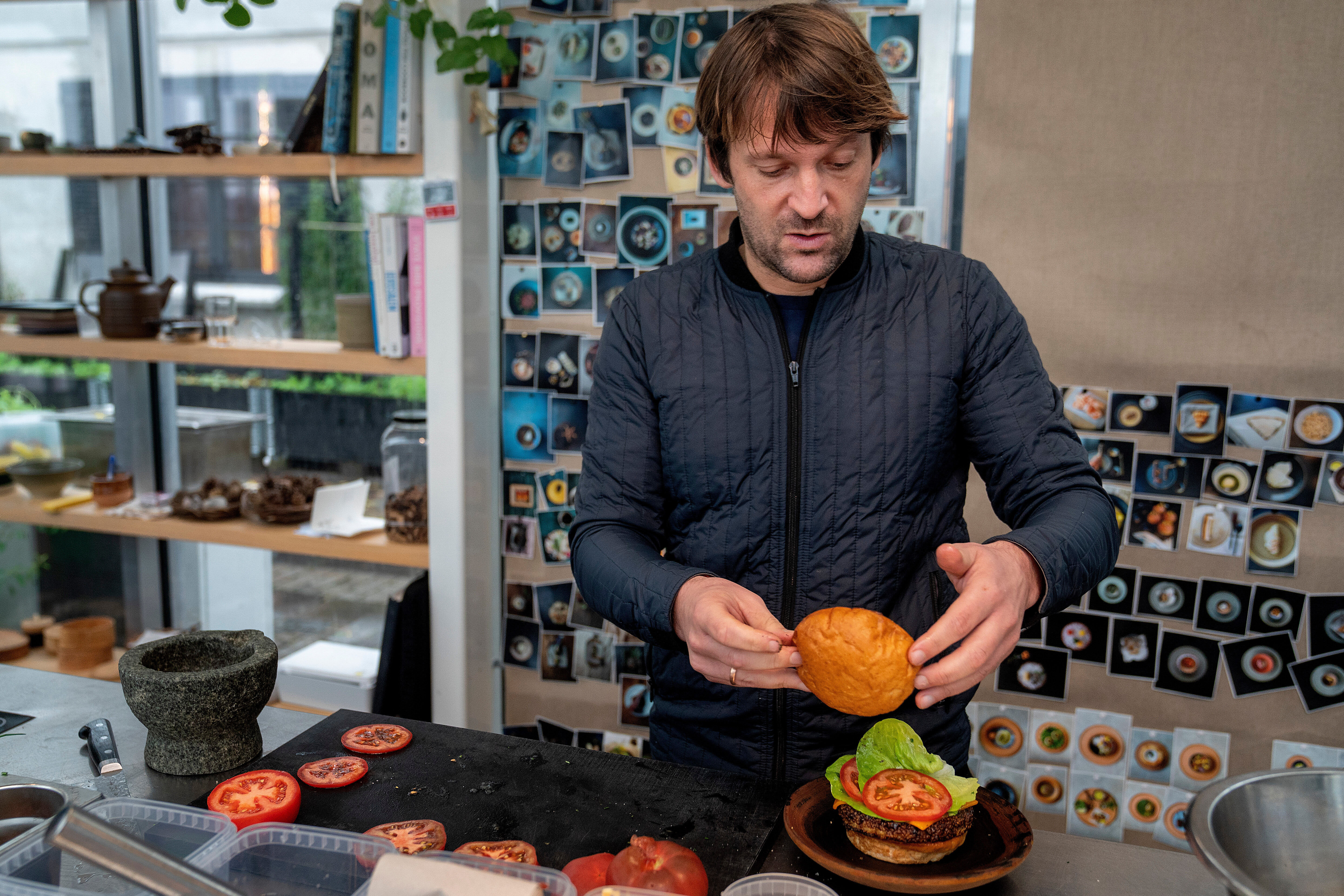 Noma's chef Ren&eacute; Redzepi prepares a vegetarian burger in a restaurant, in Copenhagen, Nov. 24, 2024.
