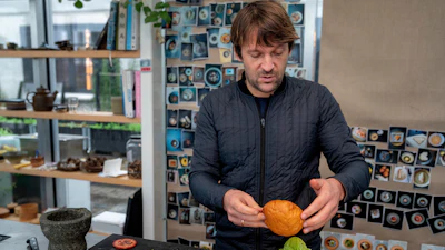Noma's chef René Redzepi prepares a vegetarian burger in a restaurant, in Copenhagen, Nov. 24, 2024.