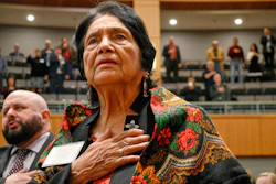 Dolores Huerta stands for the Pledge of Allegiance in Spanish while visiting the New Mexico Statehouse, Santa Fe, Feb. 27, 2019.