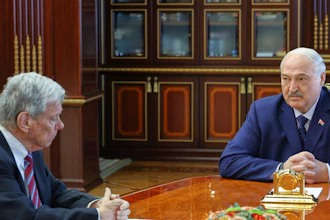 In a photo released by the Belarusian presidential press service, Belarusian President Alexander Lukashenko, right, and U.S. Presidential envoy John Coale meet in Minsk, Belarus, March 19, 2026.
