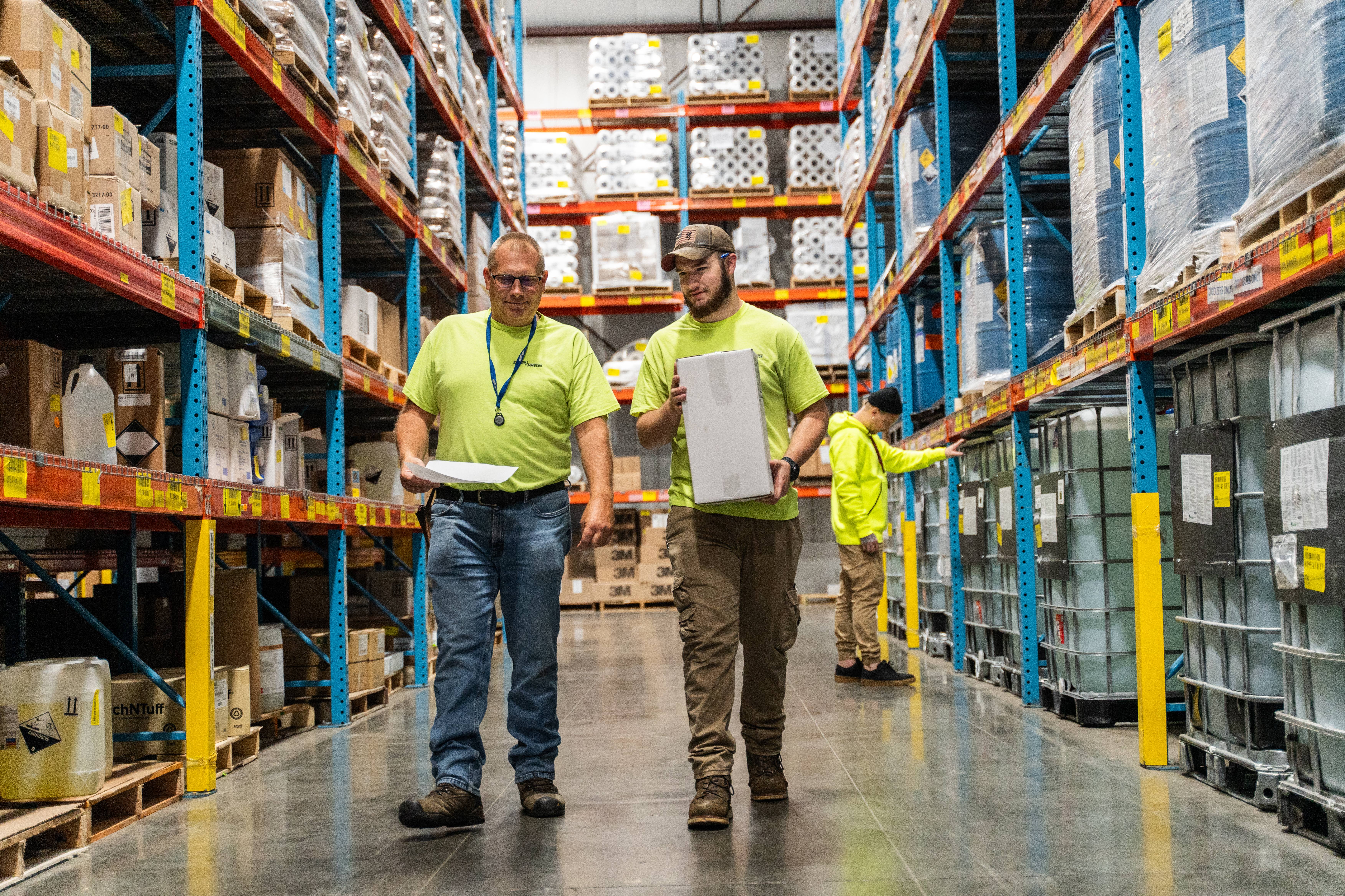 Warehouse Employees Talking And Walking (1)