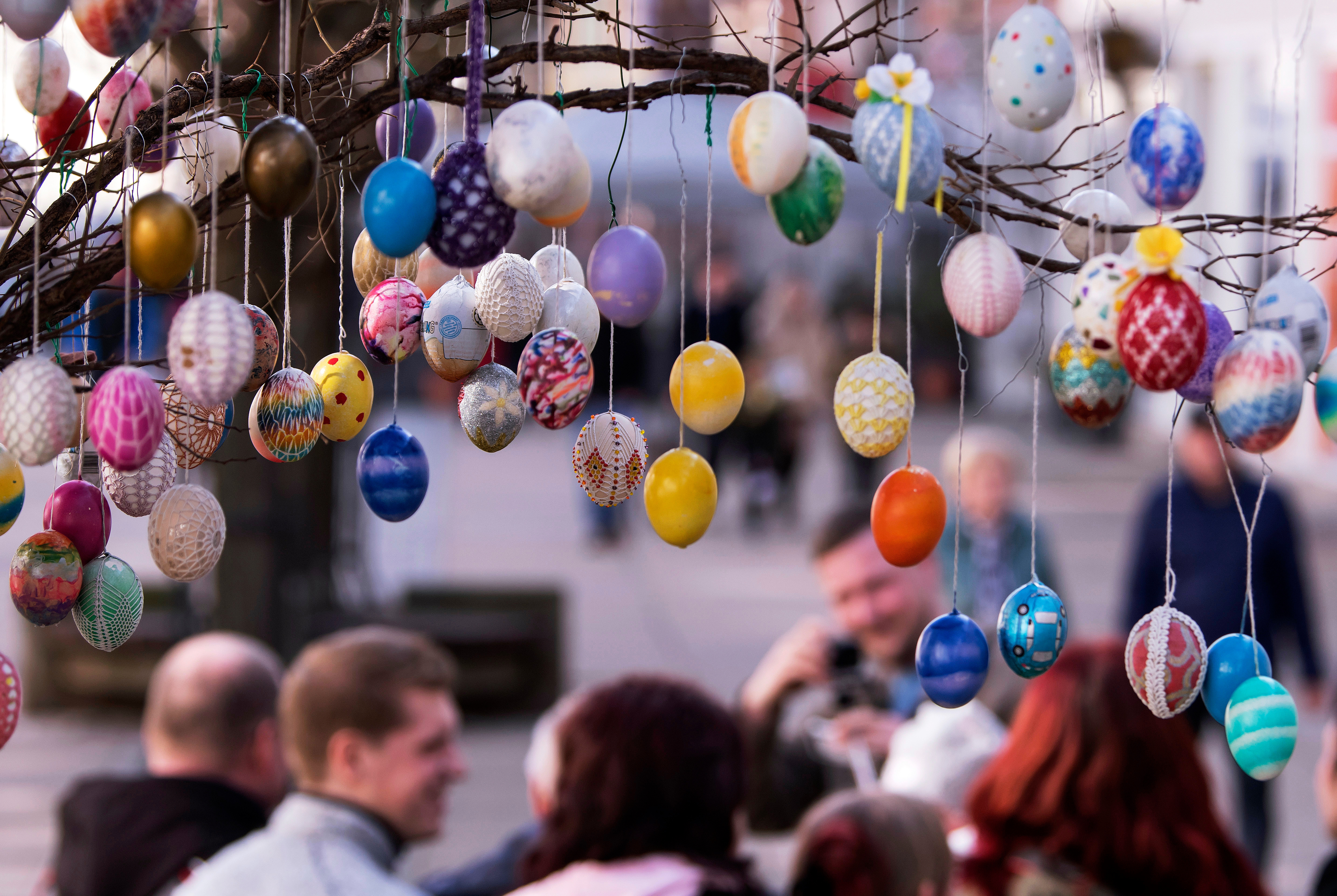 Painted Easter eggs hang from an Easter Tree in Saalfeld, Germany, March 30, 2018.