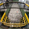Ground up plastics that Alterra Energy receives from recycling facilities, move along a conveyor at the start of their process that transforms the material into a liquid that is then used in the manufacturing of plastic in Akron, Ohio, Sept. 8, 2022.