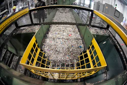 Ground up plastics that Alterra Energy receives from recycling facilities, move along a conveyor at the start of their process that transforms the material into a liquid that is then used in the manufacturing of plastic in Akron, Ohio, Sept. 8, 2022.