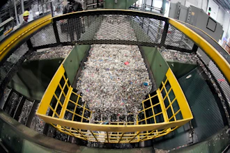 Ground up plastics that Alterra Energy receives from recycling facilities, move along a conveyor at the start of their process that transforms the material into a liquid that is then used in the manufacturing of plastic in Akron, Ohio, Sept. 8, 2022.
