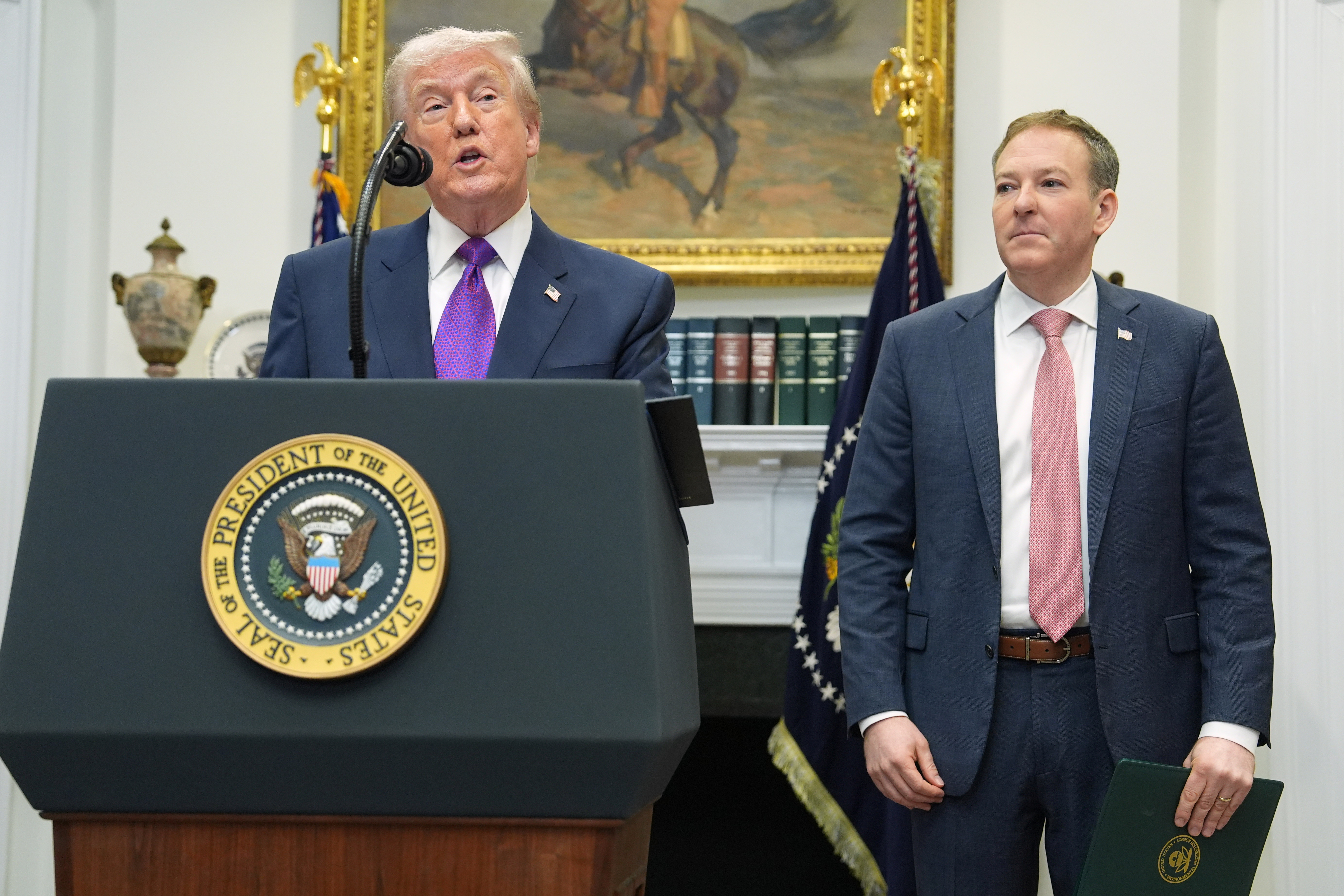 President Donald Trump, left, speaks during an event with Environmental Protection Agency director Lee Zeldin in the Roosevelt Room of the White House, Feb. 12, 2026, in Washington.