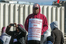 Workers from the JBS Beef Plant protest across the road from the plant on March 16, 2026 in Greeley, Colo.